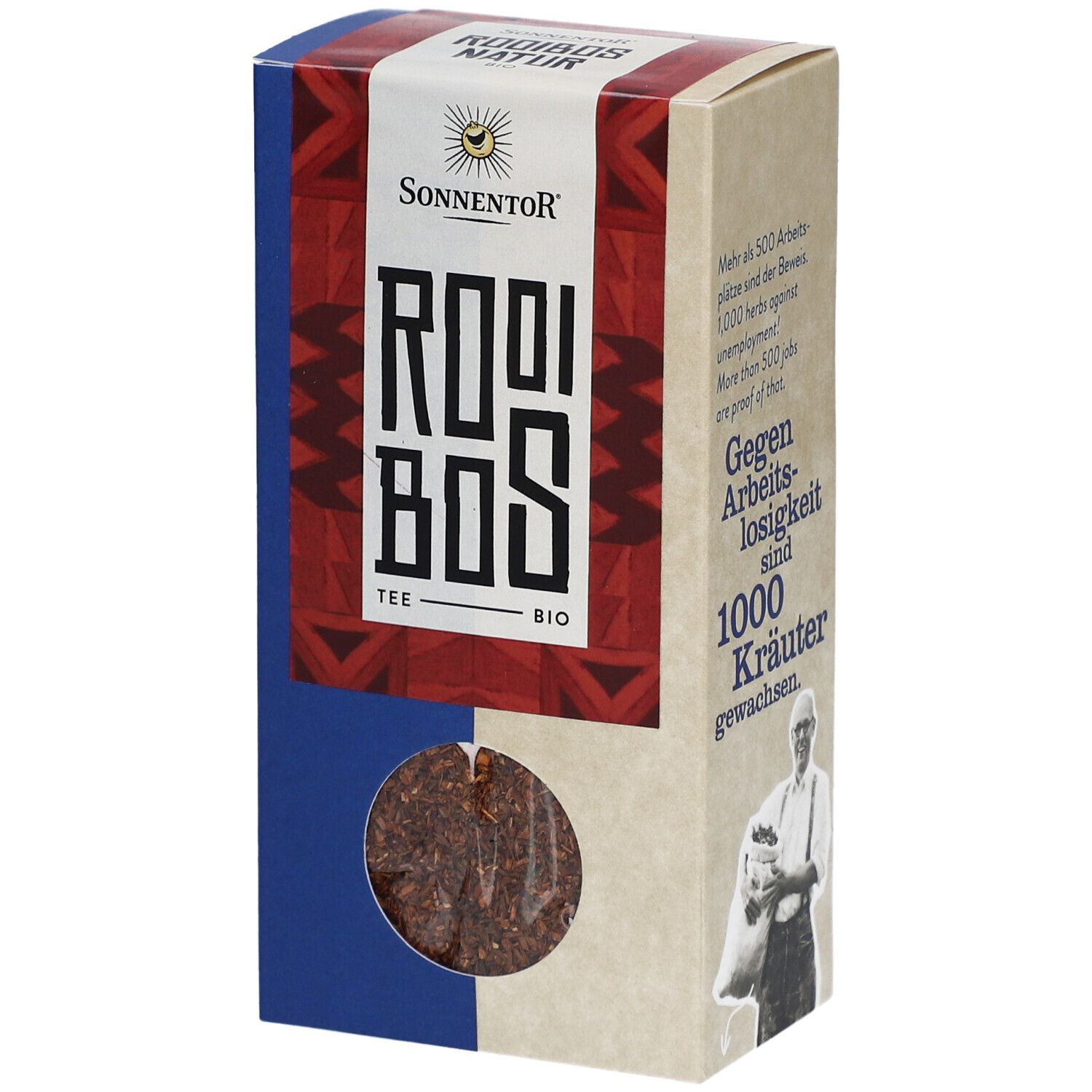 Boîte en carton avec fenêtre. Inscription : Sonnentor, Rooibos Tee Bio. Produit visible : thé Rooibos en vrac.