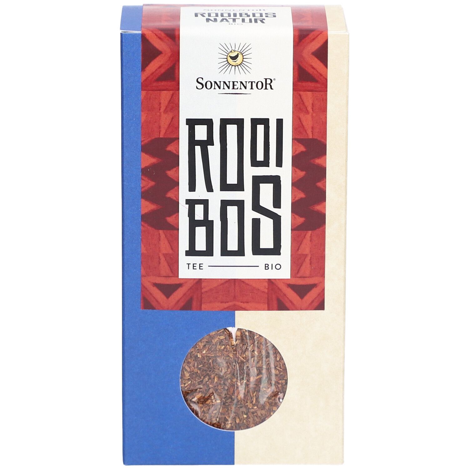 Boîte en carton avec fenêtre. Inscription : Sonnentor, Rooibos Tee Bio. Produit visible : thé Rooibos en vrac.