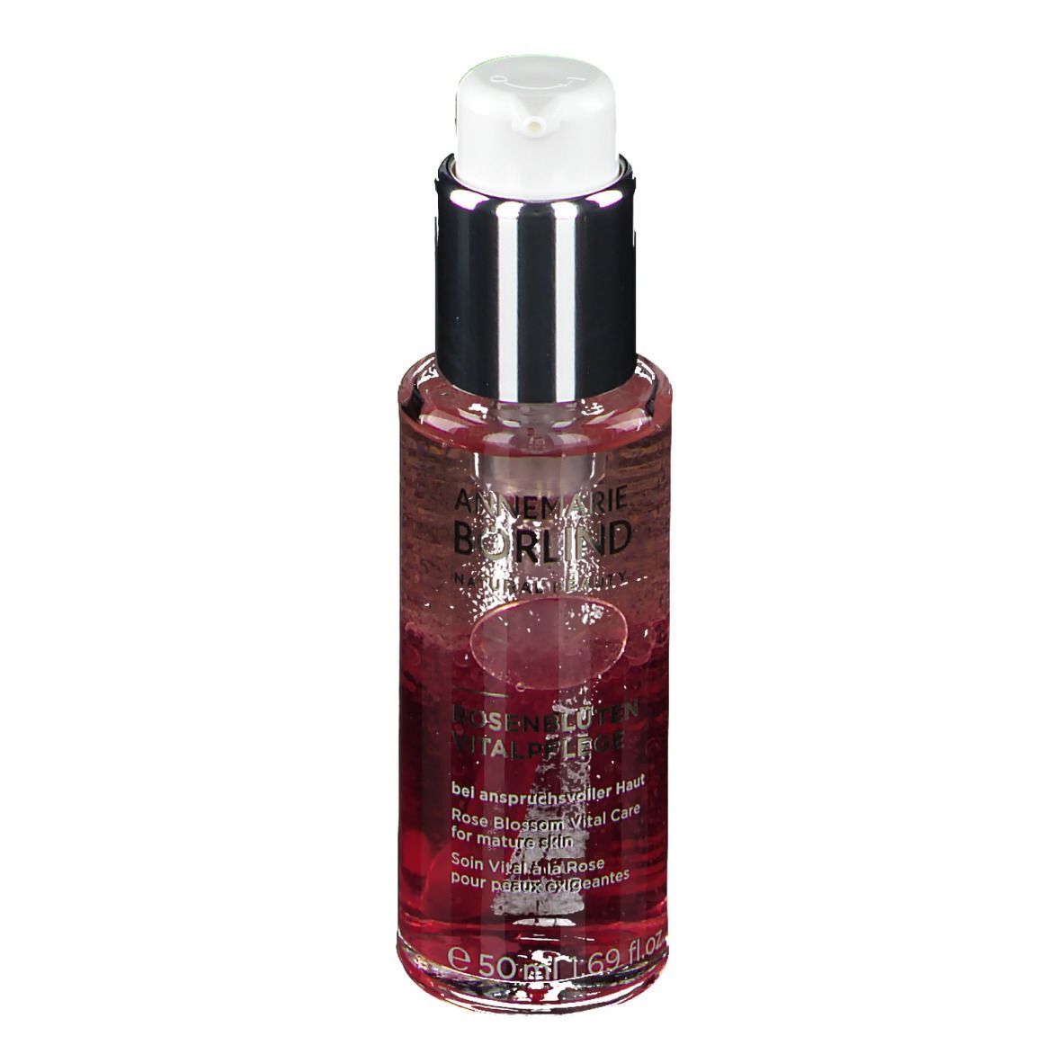 Flacon avec liquide. Inscription: ANNEMARIE BÖRLIND. Rosenblüten Vitalpflege. Pour peaux matures. Avec distributeur.