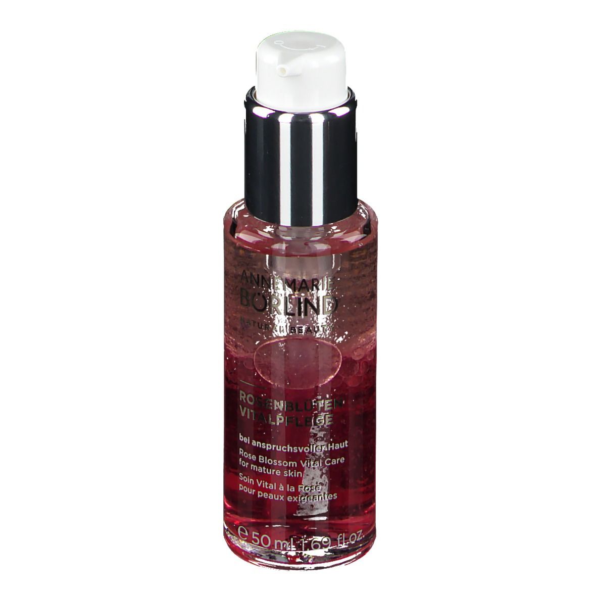 Flacon avec liquide. Inscription: ANNEMARIE BÖRLIND. Rosenblüten Vitalpflege. Pour peaux matures. Avec distributeur.