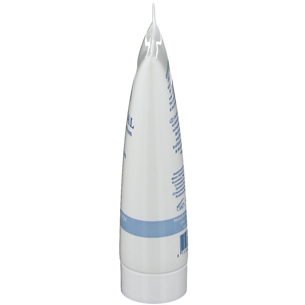 Vue latérale du tube. Tube blanc avec texte bleu. Fermé en haut, bouchon blanc en bas.