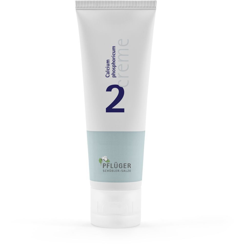 Tube de crème blanche avec impression bleue. Contient du Calcium phosphoricum. Marque : Pflüger. Numéro 2.