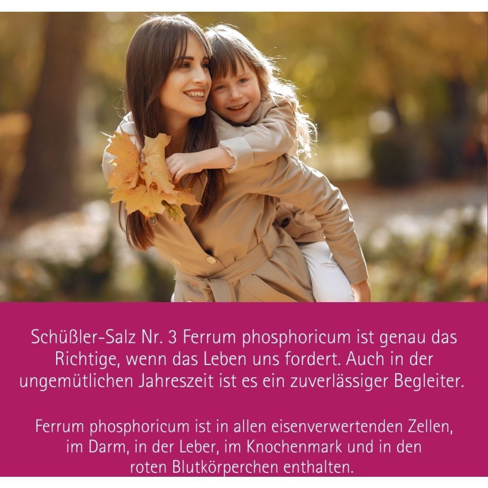 Mère et enfant en extérieur. Texte : Sel de Schüssler n° 3 Ferrum phosphoricum. Texte en rouge.