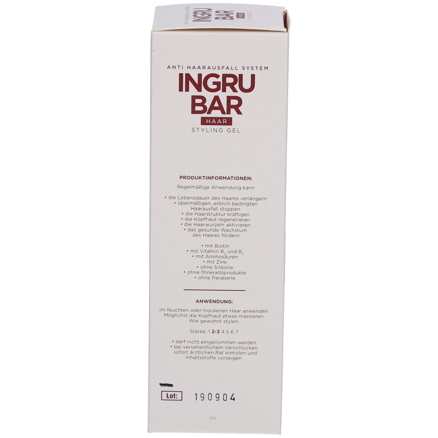 Boîte blanche avec logo et texte rouges. Texte avec informations sur le produit et instructions d'utilisation. Système anti-chute de cheveux.