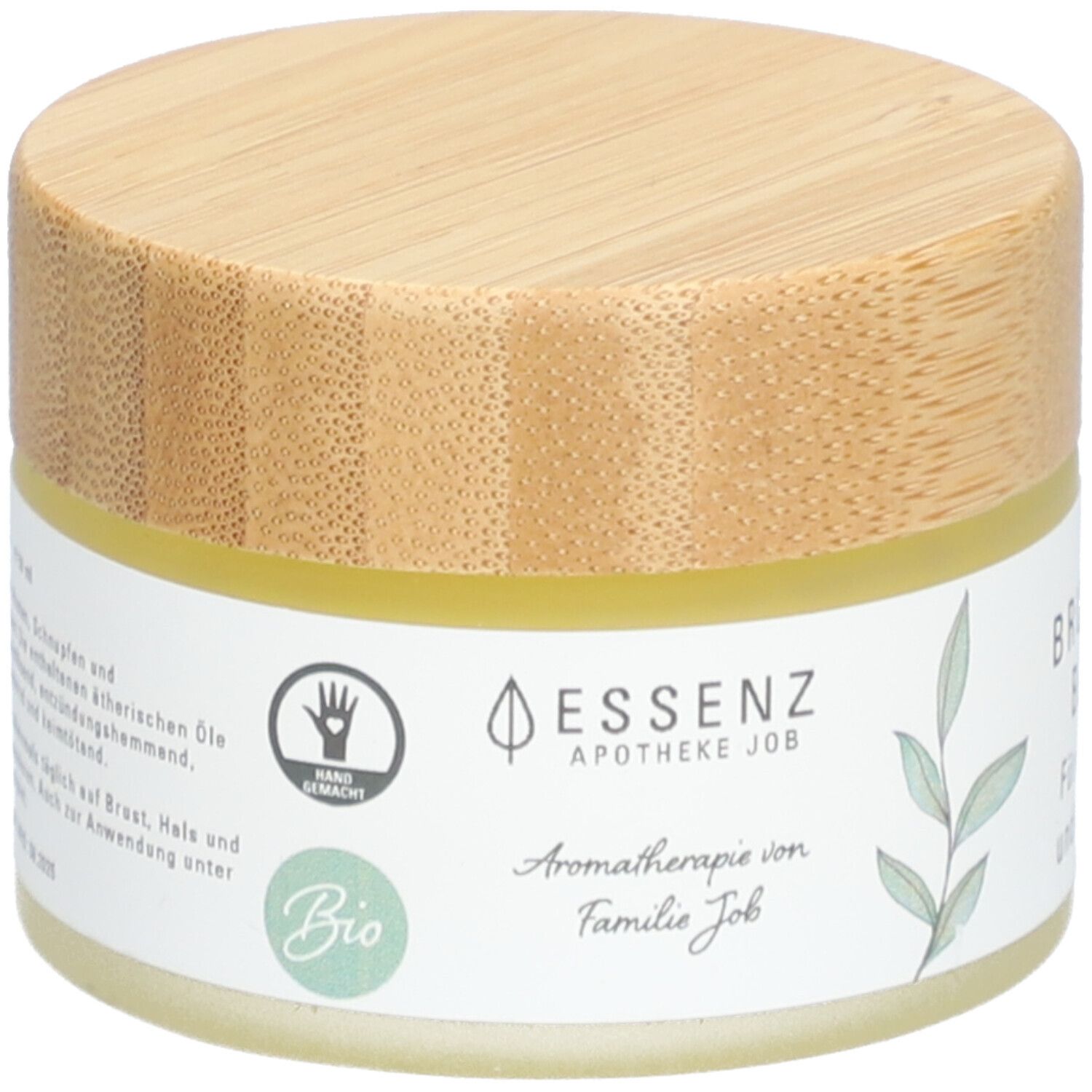 Creme-Tiegel mit Holzdeckel. Aufschrift: ESSENZ, Apotheke Job, Bio. Handgemacht-Siegel. Aromatherapie von Familie Job.