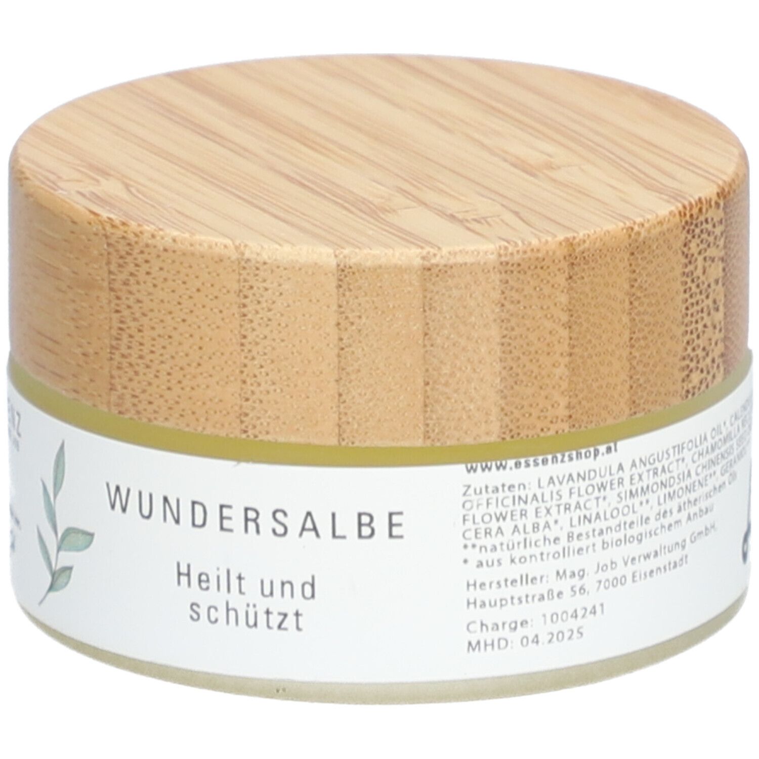Pot de crème avec couvercle en bois. Inscription : Wundersalbe, Heilt und schützt. Texte : Ingrédients, adresse du fabricant, lot, DDM.