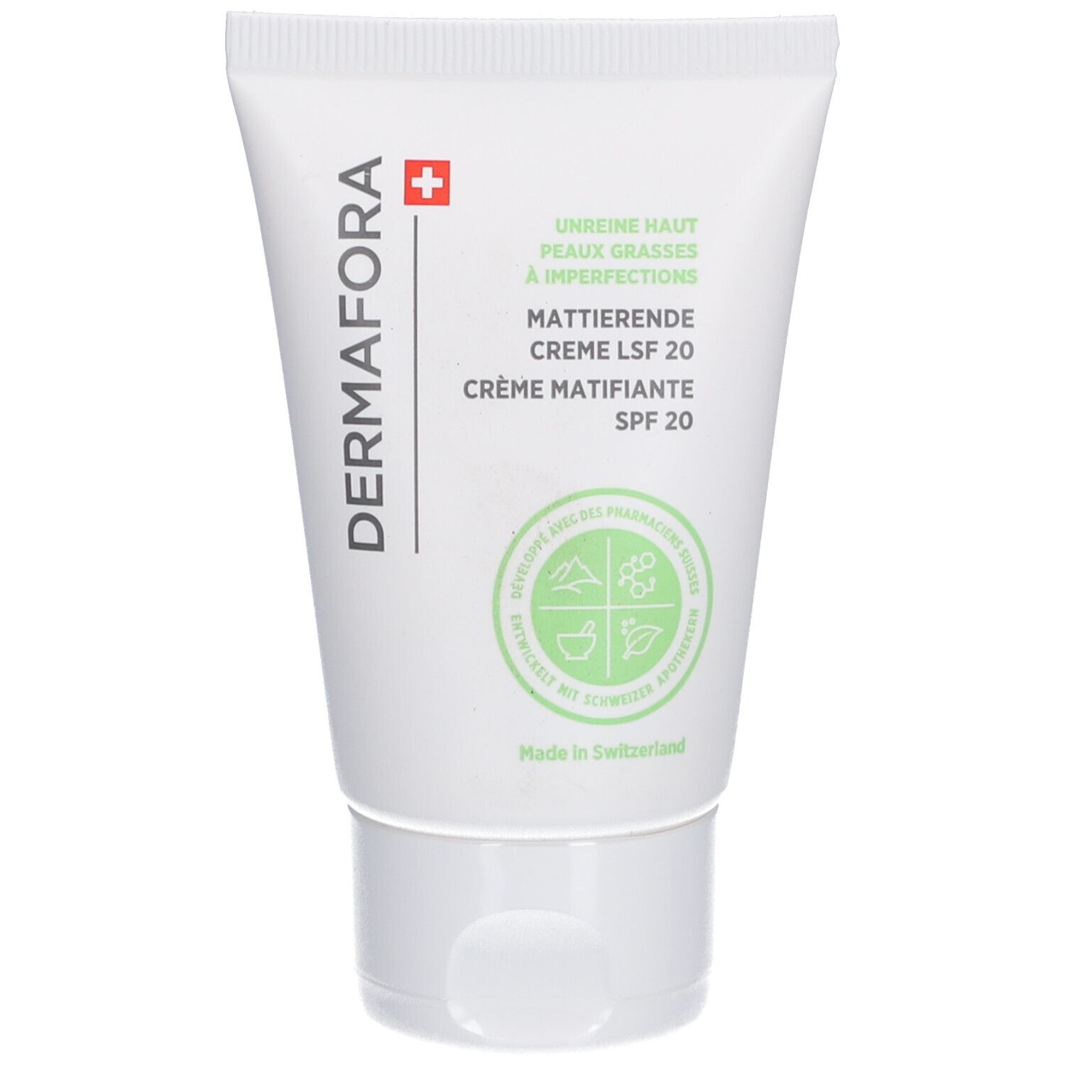Tube blanche avec impression verte. Texte: DERMAFORA, Crème Matifiante SPF 20. Croix suisse.