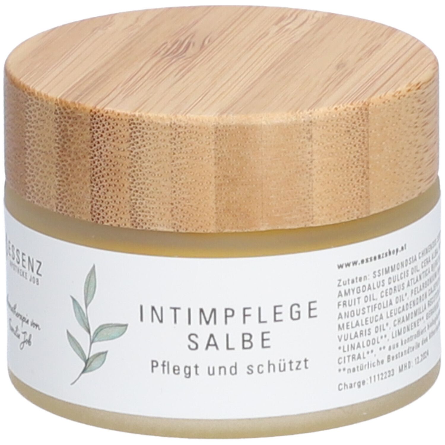 Pot de crème avec couvercle en bois. Inscription : Intimpflege Salbe. Soigne et protège. Liste des ingrédients visible.