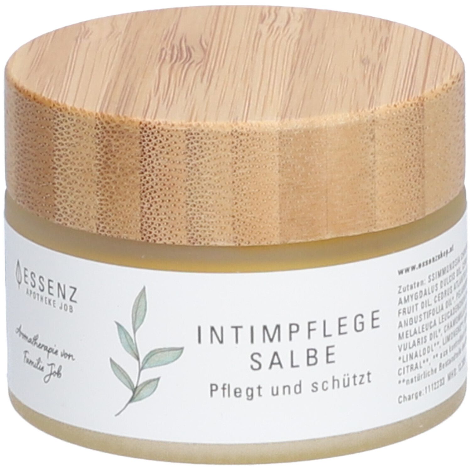 Pot de crème avec couvercle en bois. Inscription : Intimpflege Salbe. Soigne et protège. Essenz Apotheke Job.