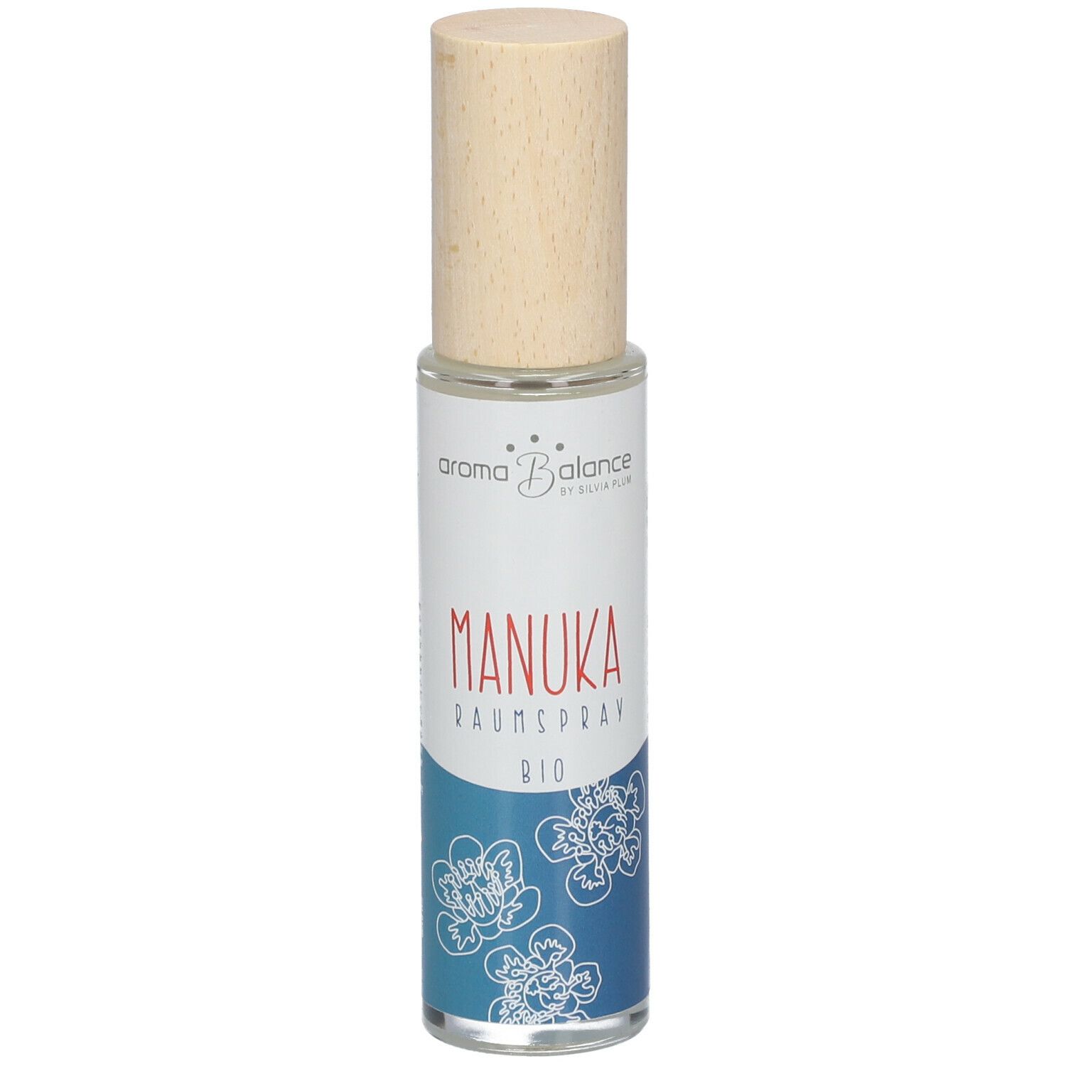 Aroma Balance Manuka Raumspray Bio. Zylindrische Glasflasche mit Holzverschluss. Etikett mit Produktnamen und floralem Muster.