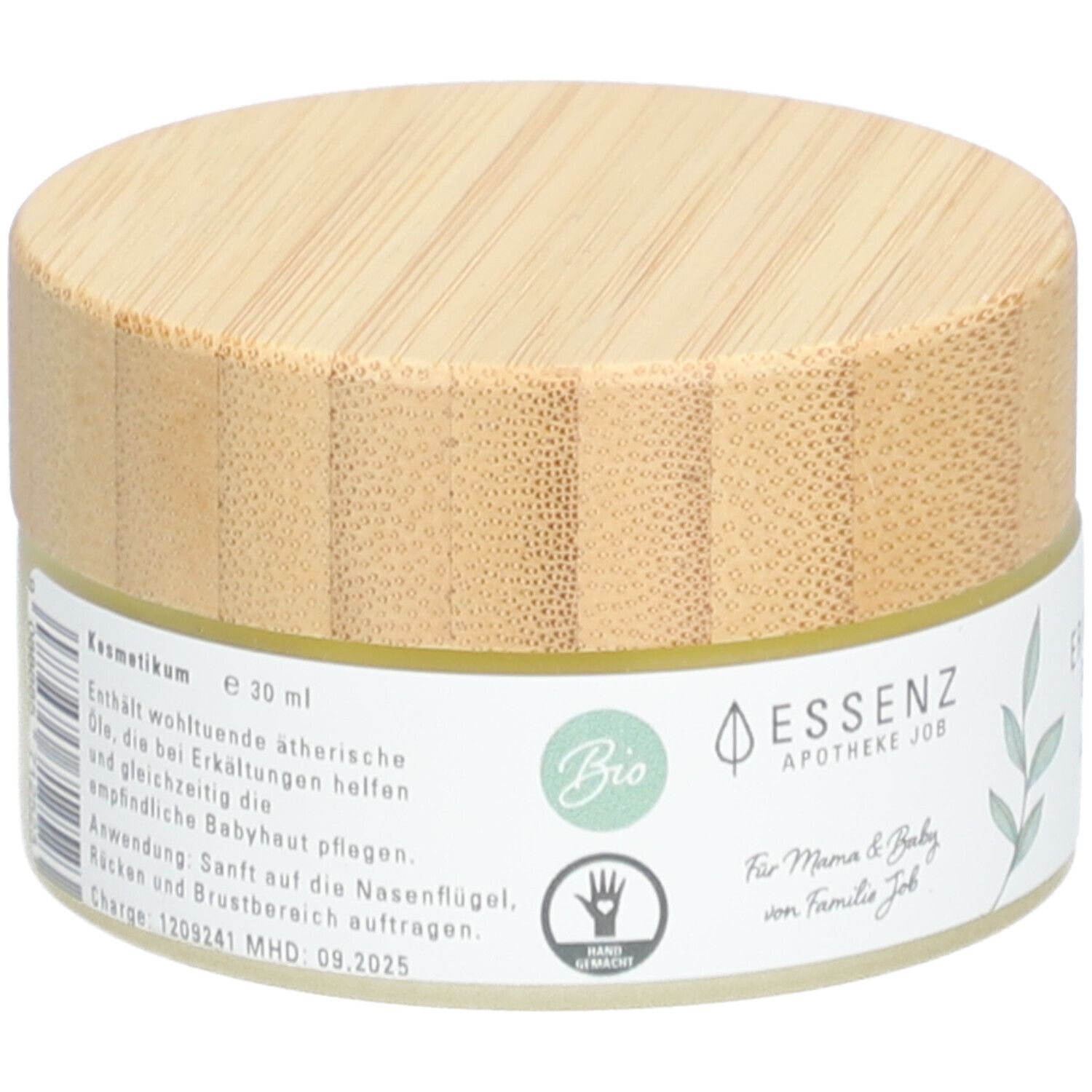 Pot rond avec couvercle en bois. Inscription : Kosmetikum, label Bio, symbole de main. Logo : Essenz Apotheke Job. Texte : Für Mama & Baby.
