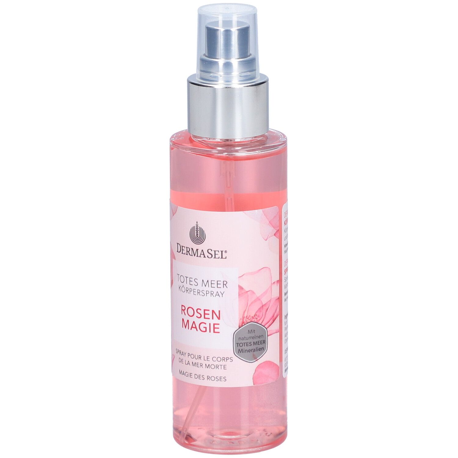 Spray pour le corps avec vaporisateur. Liquide rose dans une bouteille transparente. Inscription: DERMASEL, TOTES MEER KÖPERSPRAY ROSEN MAGIE.