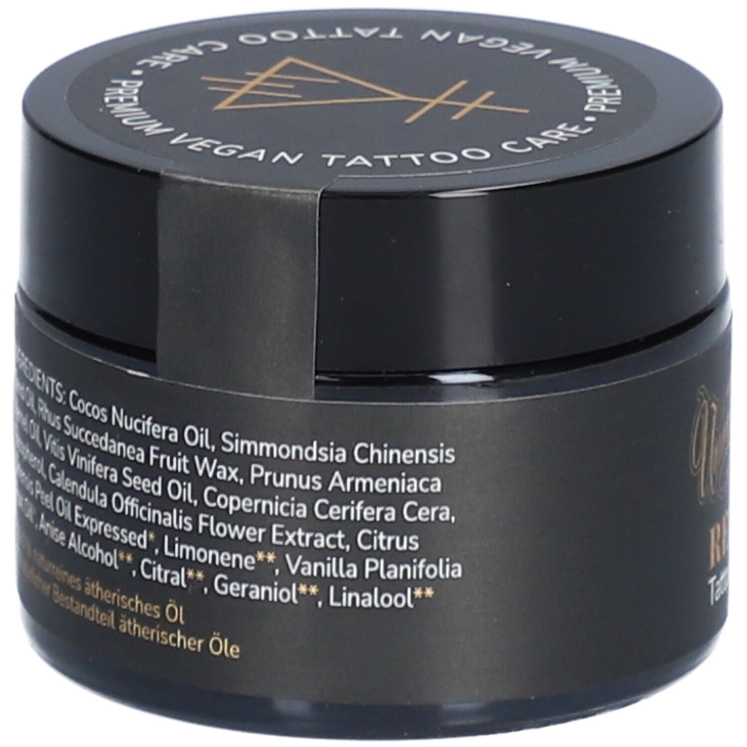 Pot noir avec liste d'ingrédients. Inscription: Ingrédients. Contient: Cocos Nucifera Oil, Simmondsia Chinensis, etc.
