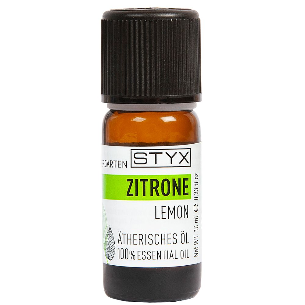 Flacon en verre brun avec bouchon noir. Étiquette avec STYX, Zitrone, Lemon, Huile essentielle. 10 ml.