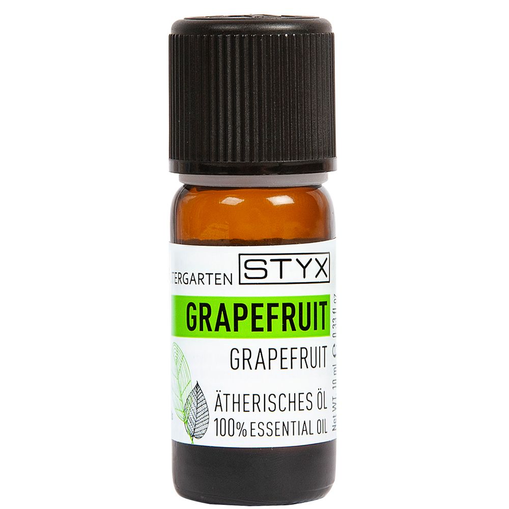 Flacon en verre brun avec bouchon noir. Étiquette avec STYX, pamplemousse et huile essentielle. 10 ml.