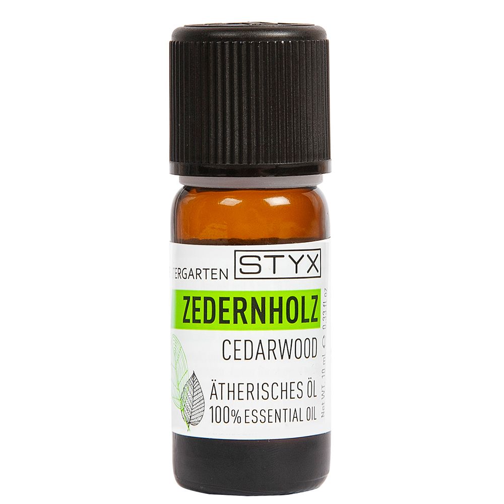 Flacon en verre brun avec bouchon noir. Inscription : ZEDERNHOLZ, CEDARWOOD, ÄTHERISCHES ÖL, 100% ESSENTIAL OIL.