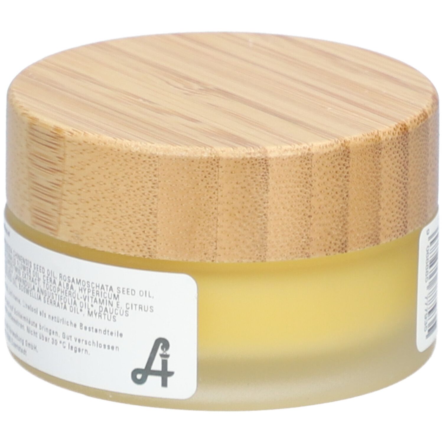 Pot rond avec couvercle en bois. Étiquette avec ingrédients. "Essenz Narbensalbe".