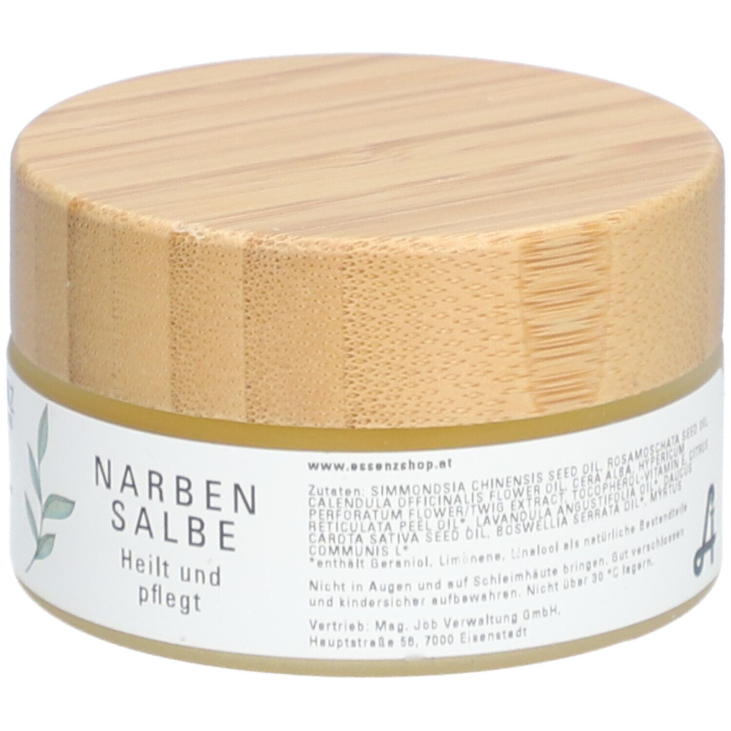 Pot rond avec couvercle en bois. Étiquette "Essenz Narbensalbe". Texte et ingrédients.
