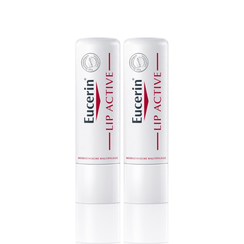 Zwei Eucerin® Lip Active Lippenpflegestifte. Weiß mit roter Schrift. Medizinische Hautpflege.