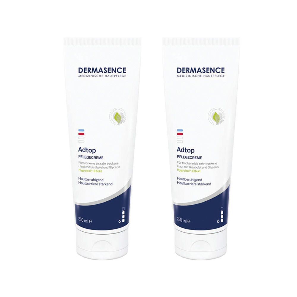Zwei Tuben DERMASENCE Adtop Pflegecreme. Weiße Tuben mit blauer und roter Markierung. Aufschrift: Adtop Pflegecreme, 200 ml.