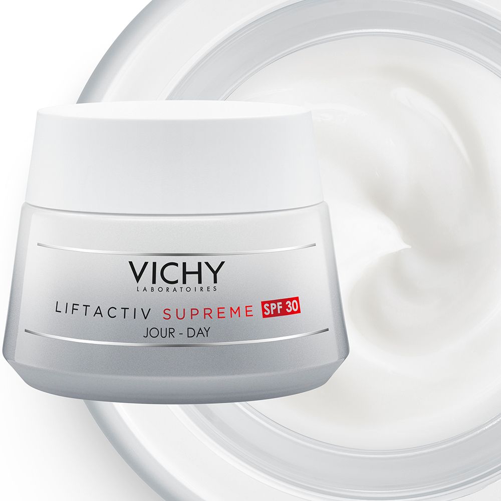 Pot de Vichy LIFTACTIV SUPREME LSF 30. Contenant gris, couvercle blanc, indication LSF 30 rouge. Tourbillon de crème.