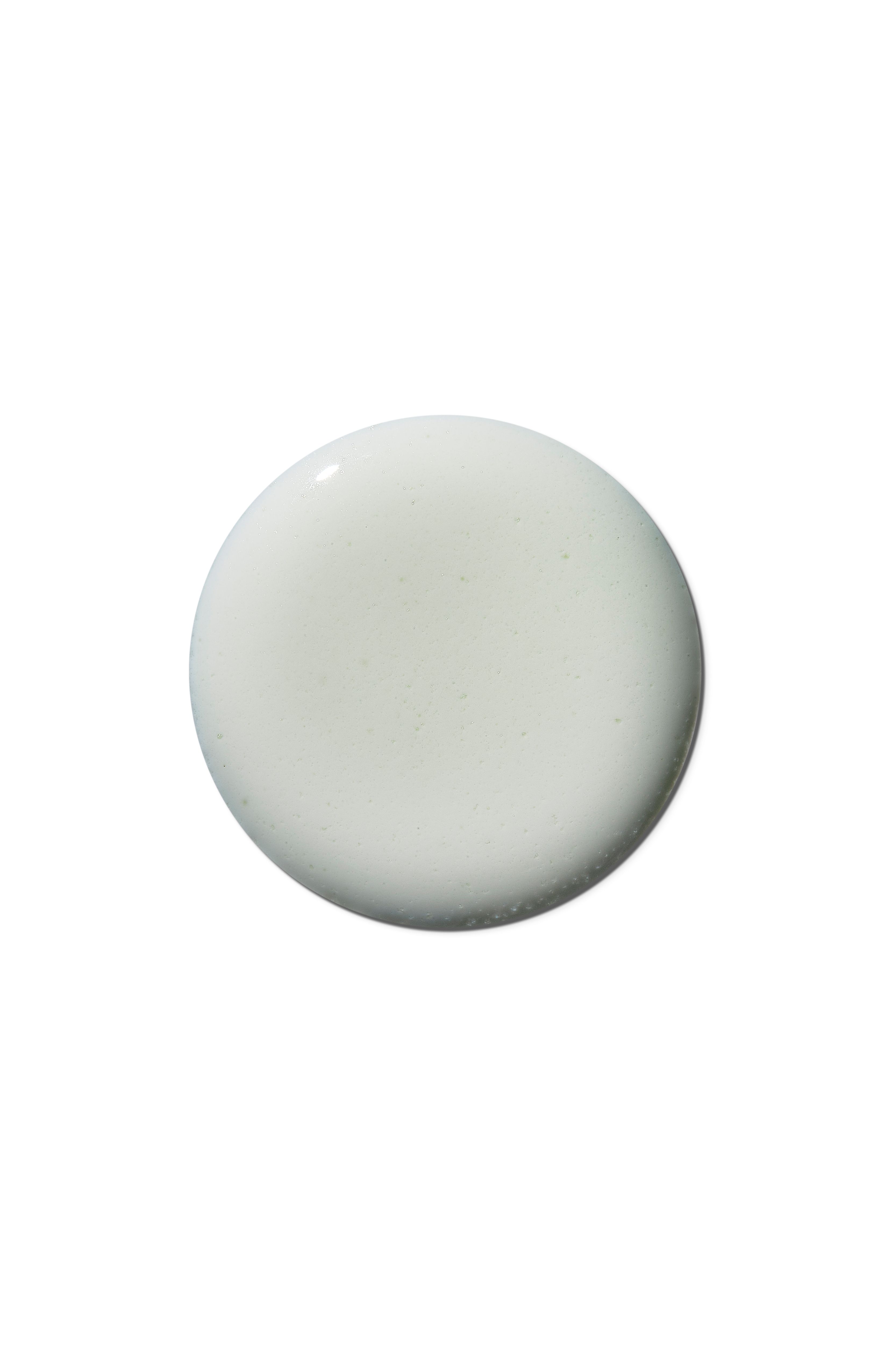 Gel blanc sur fond blanc. Forme ronde.