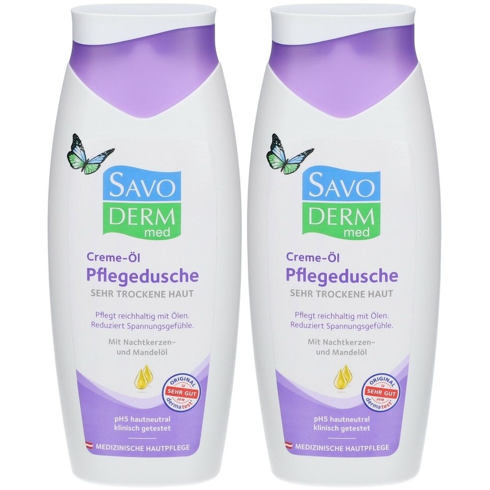 Deux flacons blancs de SAVODERM med Crème-huile de douche. Étiquettes violettes et vertes avec texte. Inscription: PEAU TRÈS SÈCHE. Avec label de qualité.