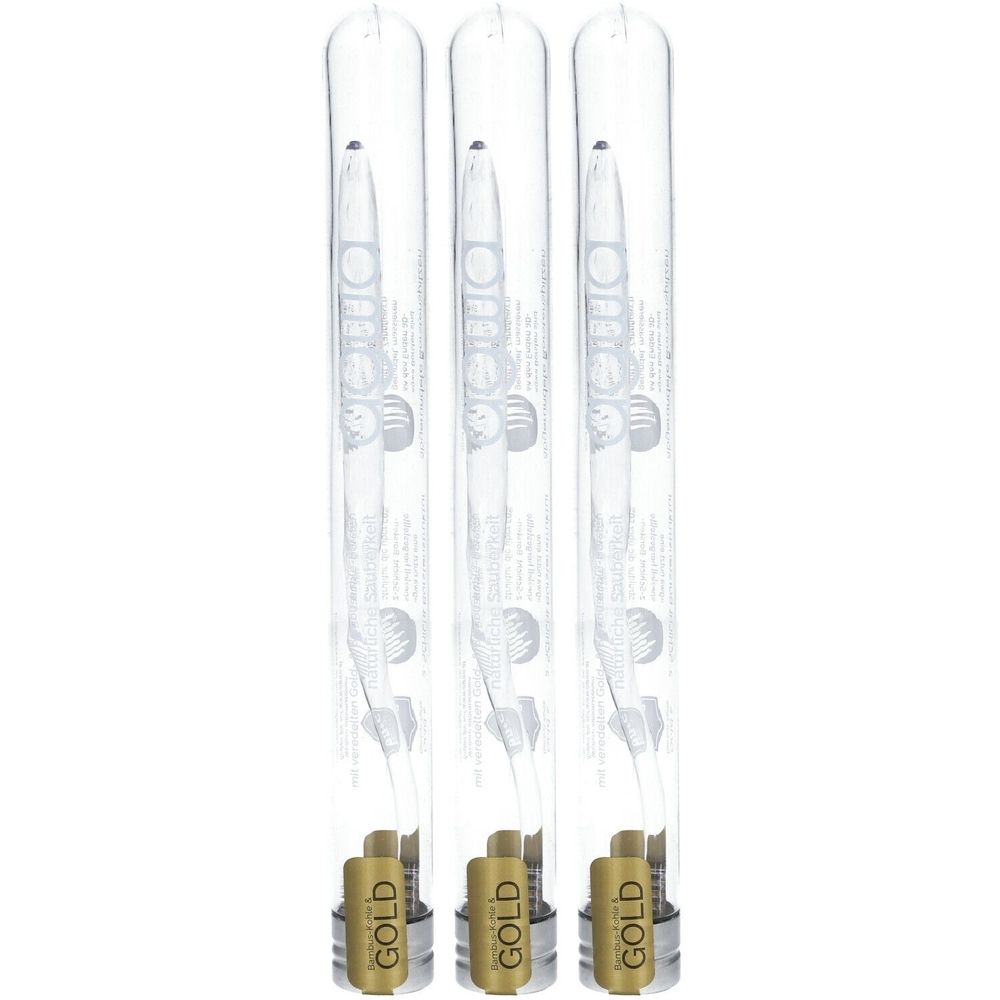 Drei Zahnbürsten in transparenten Kunststoffröhren. Goldfarbene Etiketten mit Schriftzug "GOLD".