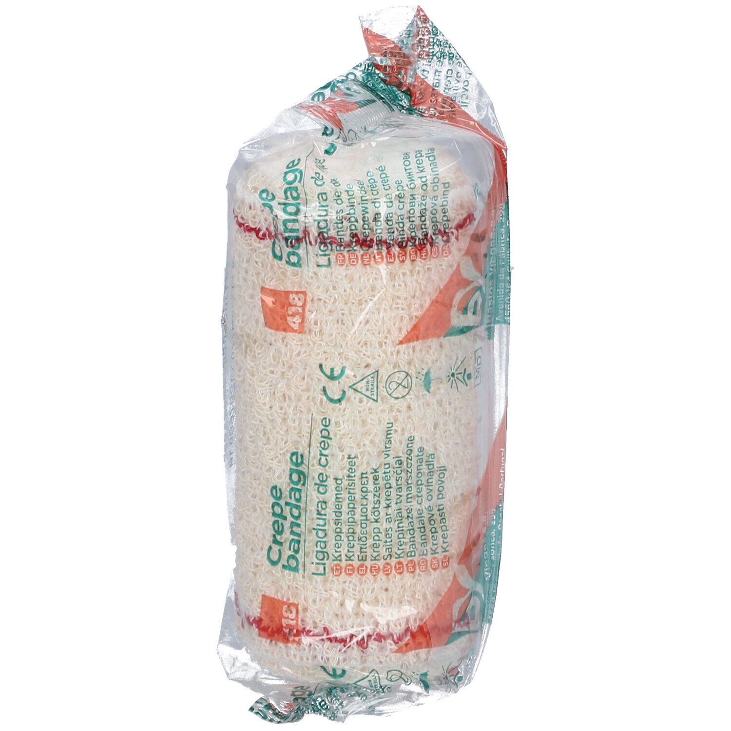 Verbandrolle in transparenter Verpackung. Aufdruck: Crepe Bandage, Ligadura de crepe. Rotes Filet. CE-Zeichen.