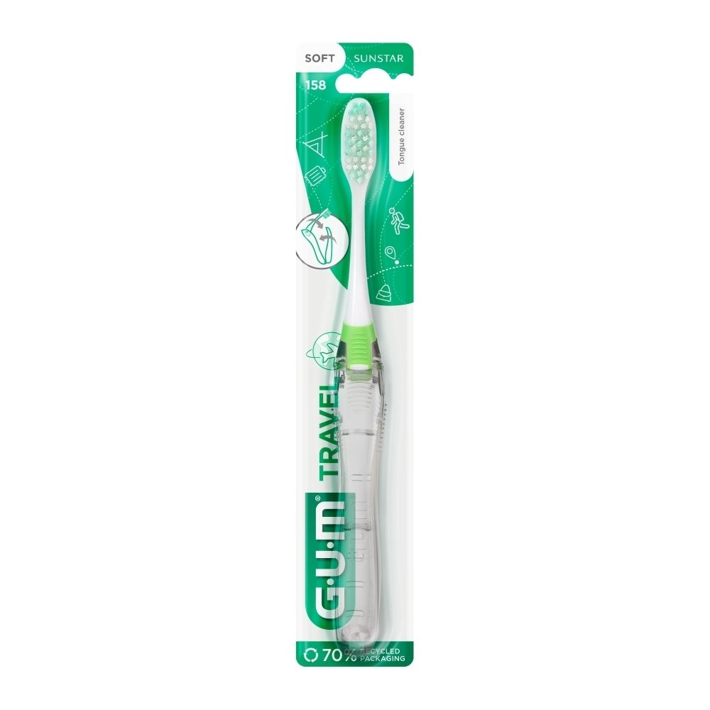 Brosse à dents dans son emballage. Soies vertes et blanches, manche vert. G.U.M. Travel. Soies souples. Sunstar.