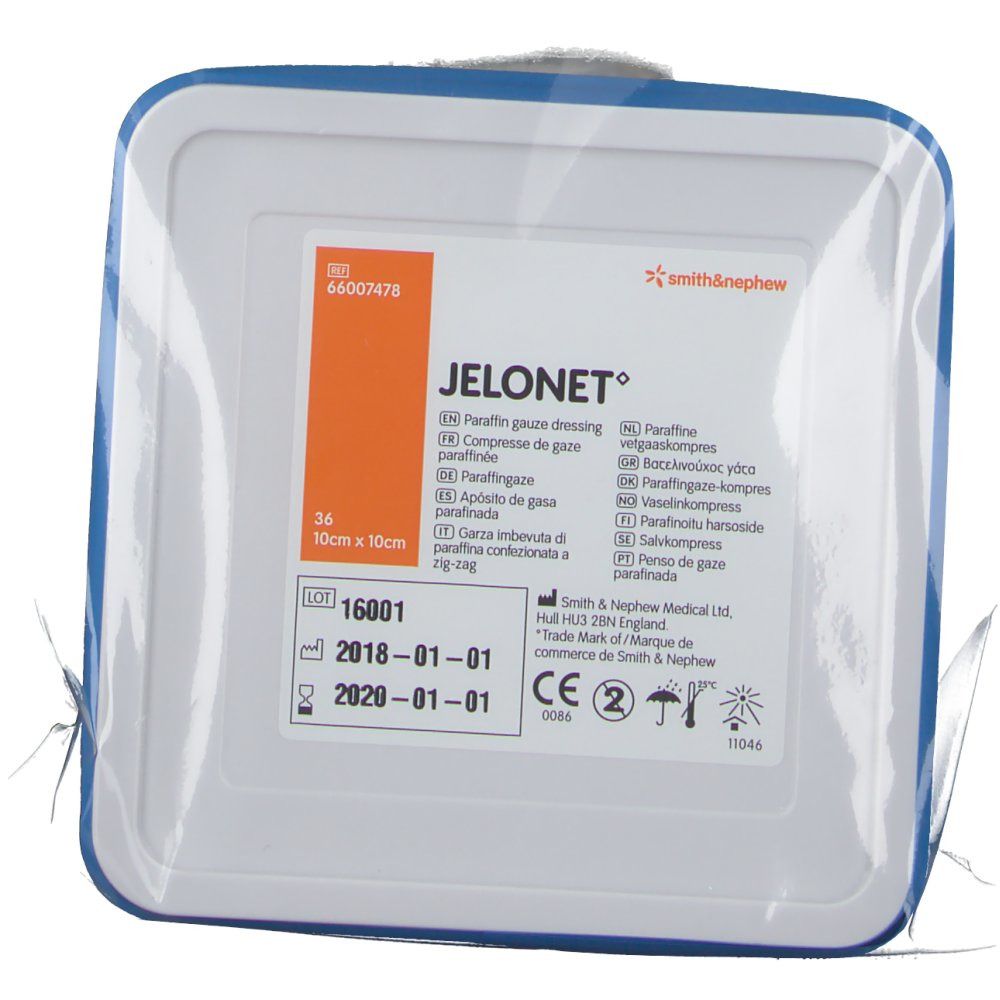 Verpackung mit JELONET Salbenkompresse. Quadratische Form, blaue Umrandung. Text: 10cm x 10cm, Smith & Nephew Logo.