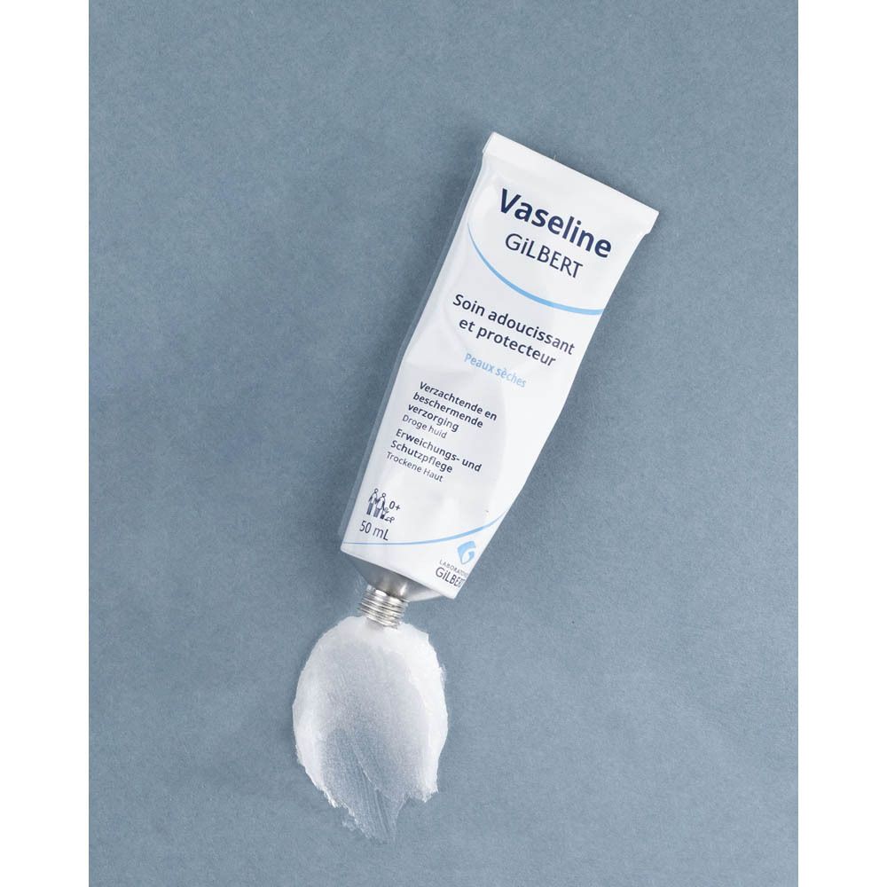 Tube avec impression. Inscription: Vaseline GILBERT, Soin adoucissant et protecteur, Peaux sèches. 50 ml. Produit sur fond.