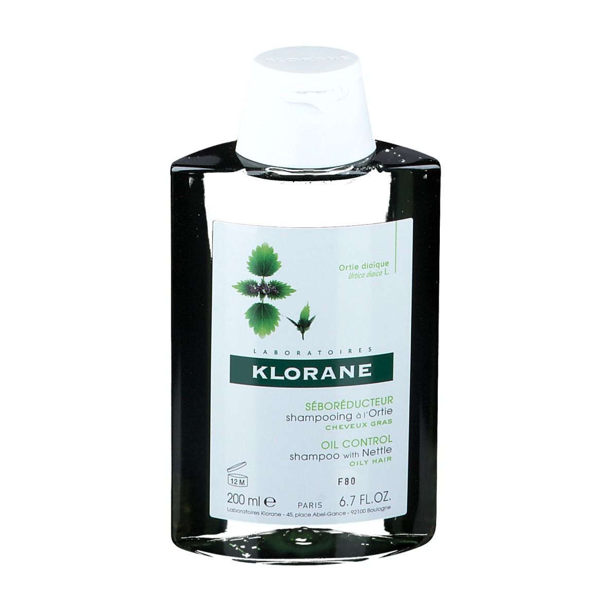 Klorane Shampoo mit Brennnessel, Flasche mit weißem Deckel. Etikett mit Produktinformationen und Logo.