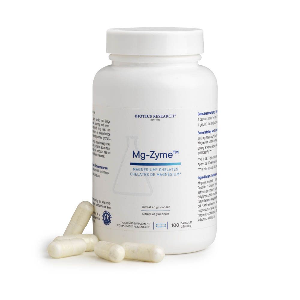 Flacon blanc avec gélules et gélules en vrac. Inscription: Mg-Zyme, chélates de magnésium. Marque: Biotics Research. 100 gélules.