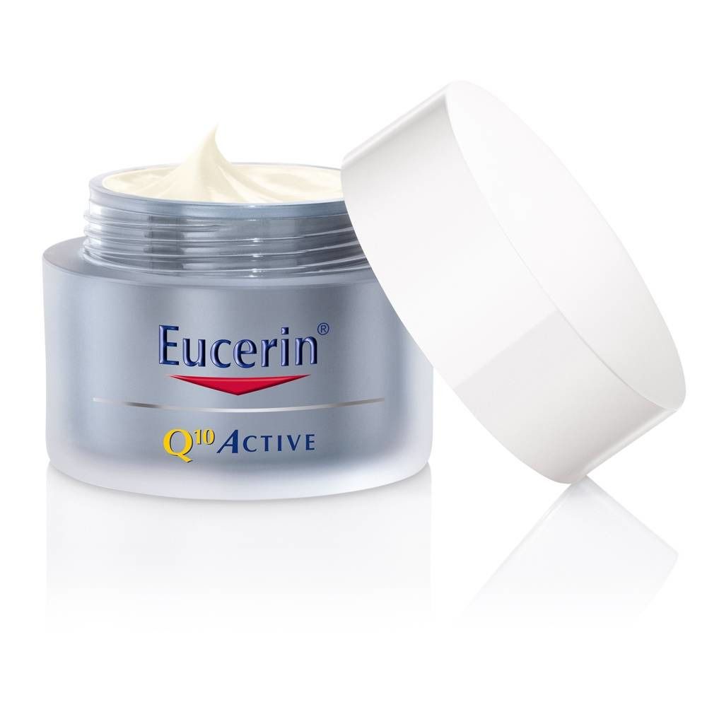 Geöffneter Cremebehälter mit Creme. Eucerin-Logo und Q10 Active-Schriftzug.