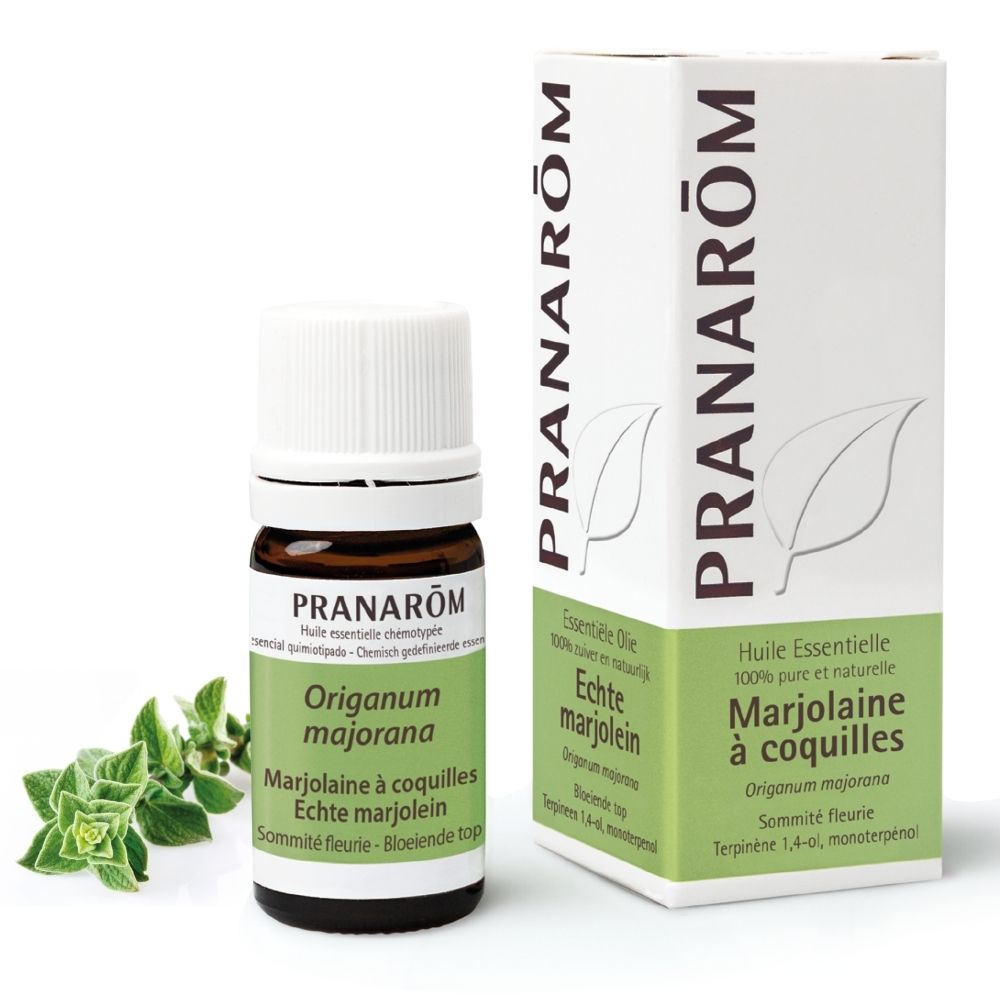 Flacon brun, boîte blanche et herbes. Boîte: PRANAROM, Marjolaine à coquilles, 5 ml.