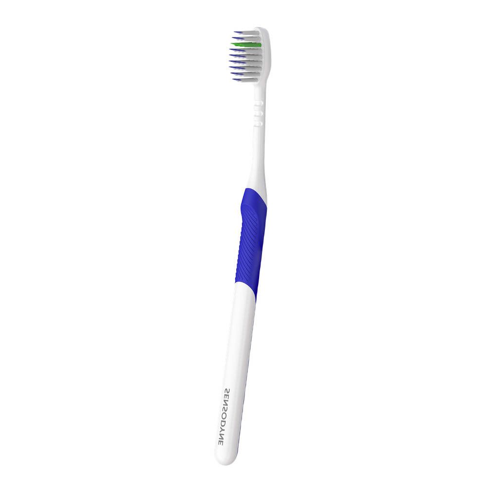 Brosse à dents avec manche bleu et tête blanche à poils verts. Le nom du produit n'est pas visible.