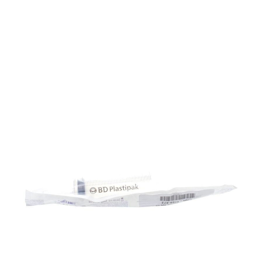 Seringue en emballage plastique. Visible: logo BD Plastipak. Cylindre blanc, piston noir.