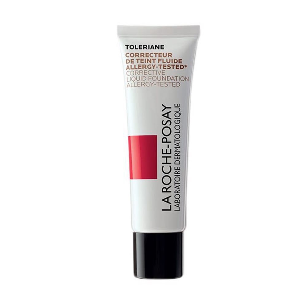 Tube de fond de teint correcteur La Roche-Posay Toleriane. Blanc, bande rouge, bouchon noir. Texte: Toleriane, Corrective Liquid Foundation.
