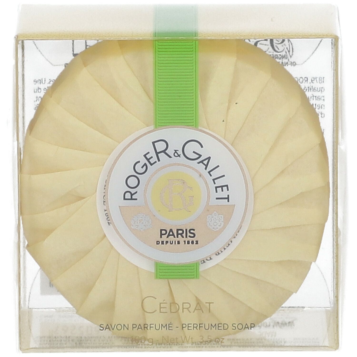 Runde Seife in Verpackung. Marke Roger & Gallet, Cédrat. Grünes Band. Transparente Hülle.