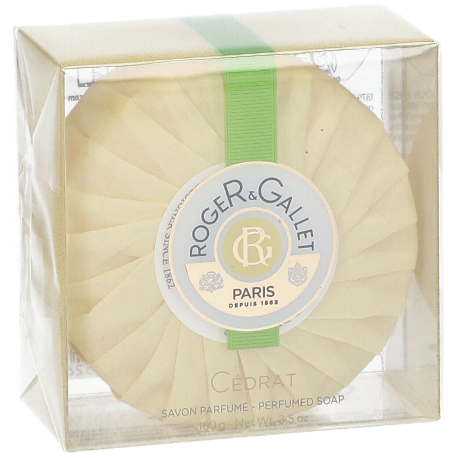 Runde Seife in Verpackung. Marke Roger & Gallet, Cédrat. Grünes Band. Transparente Hülle.