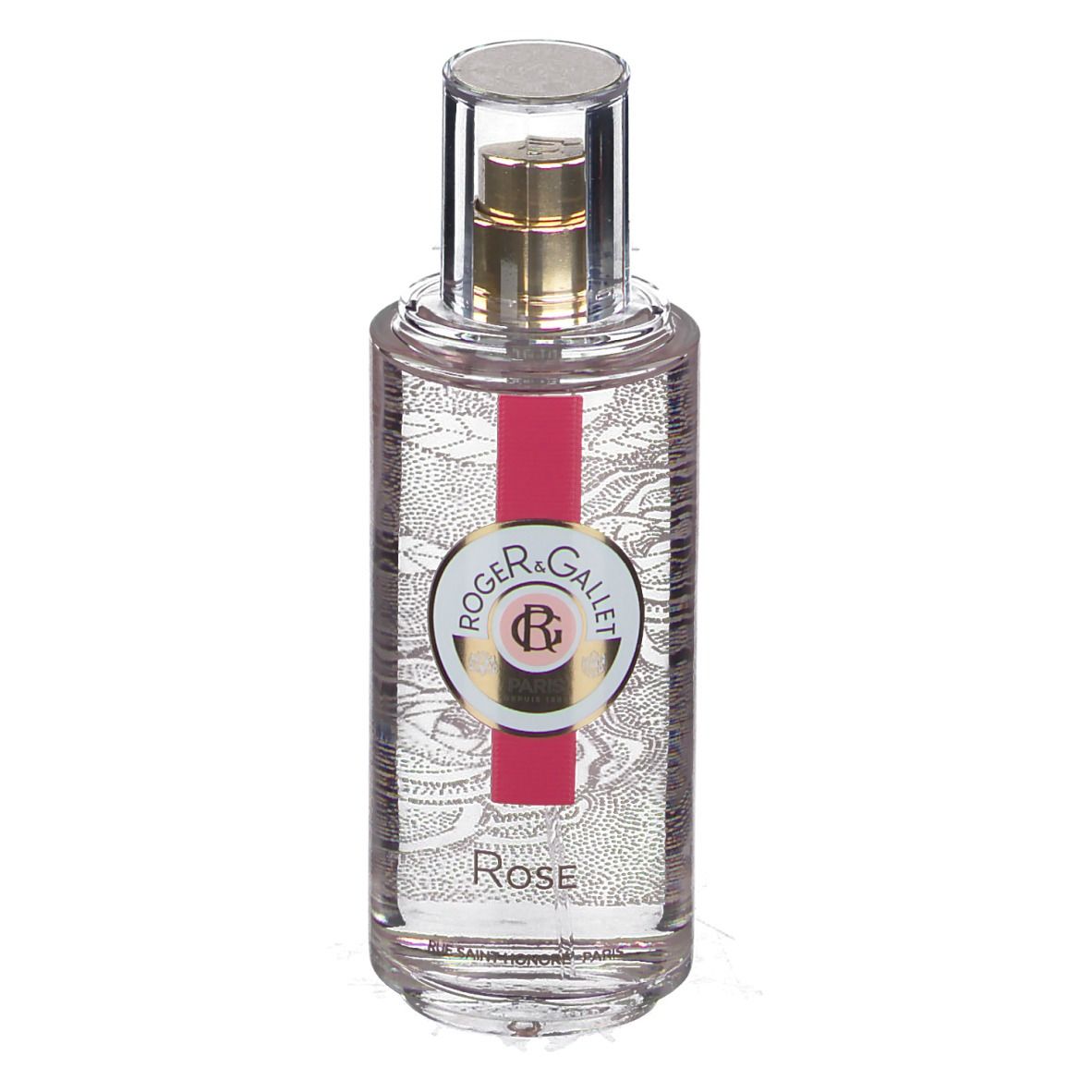 Flacon transparent avec vaporisateur doré. Étiquette avec logo et texte. Bande rouge. Inscription Rose.