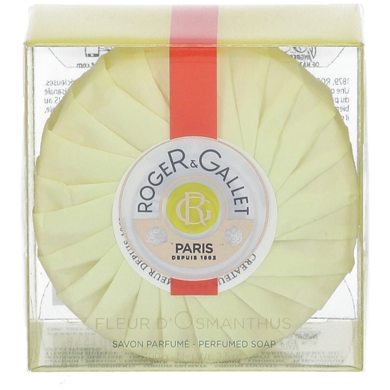 Runde Seife in gelber Verpackung. Roter Streifen. Logo: Roger & Gallet. Text: Fleur d'Osmanthus, Savon Parfume.