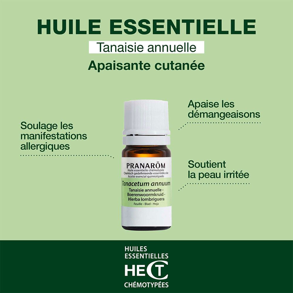 Flacon en verre brun avec bouchon bleu. Étiquette avec nom du produit et avertissements.