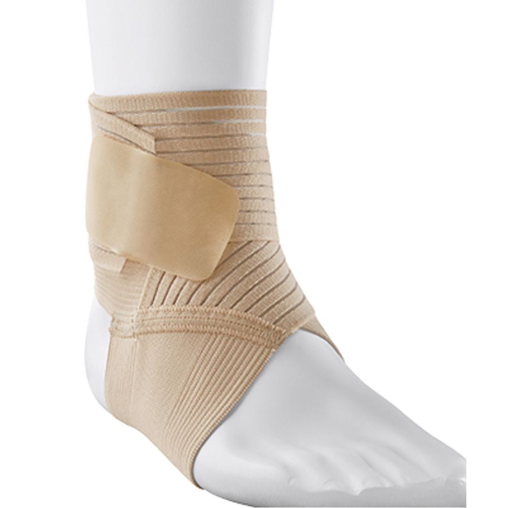 Boîte de la chevillère 3M FUTURO taille L. Bandage beige sur pied. Textes en allemand, néerlandais, français et italien.
