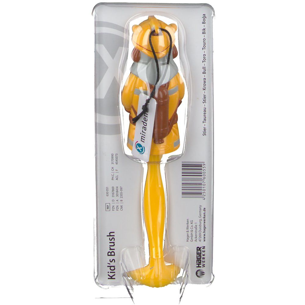 Brosse à dents en blister. Manche jaune, figurine pompier. Logo "miradent". Inscription "Kid's Brush".