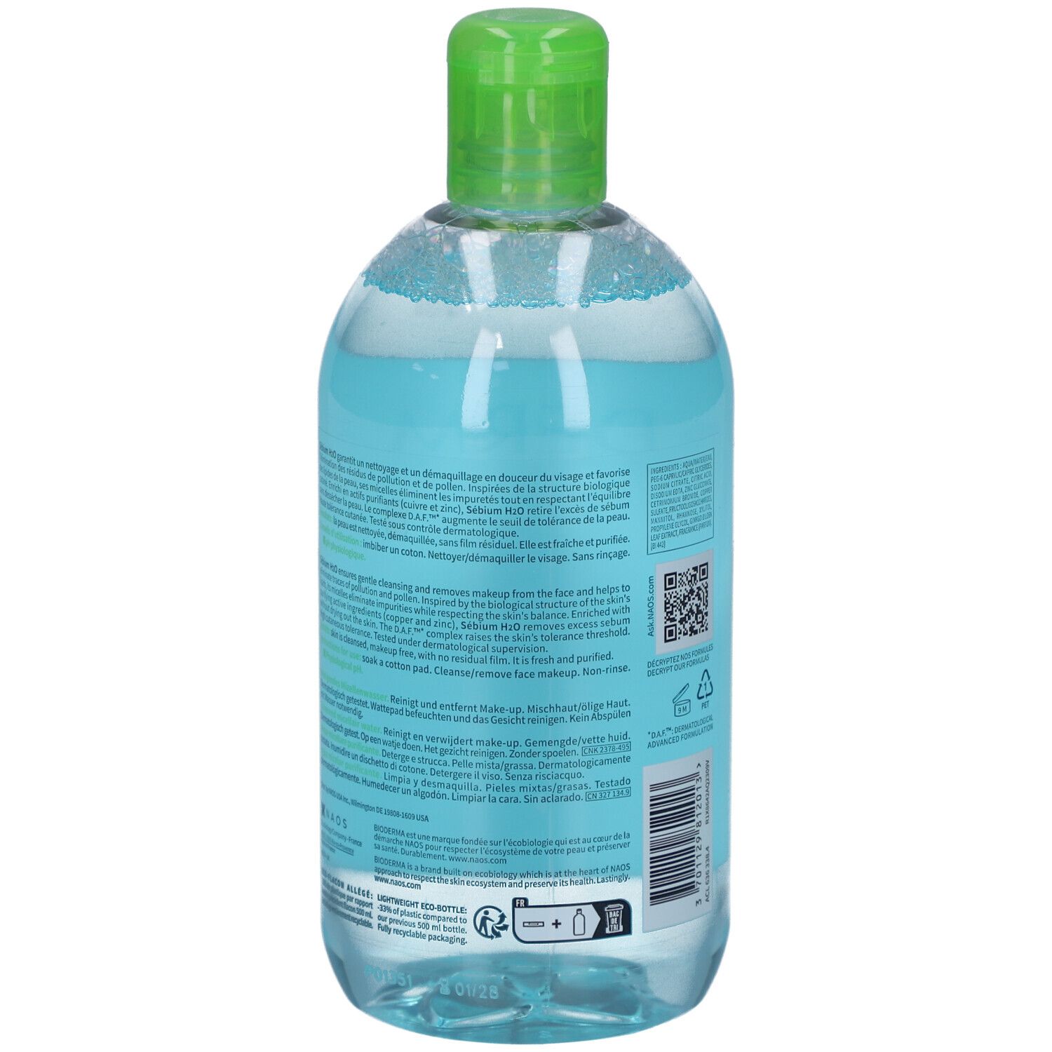 Transparente Flasche mit grüner Kappe, gefüllt mit klarer Flüssigkeit. Etikett mit Text. Rückansicht.