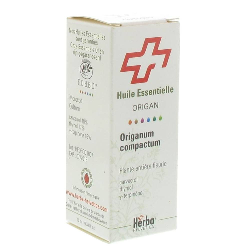 Kartonverpackung mit rotem Kreuz-Logo. Text: Huile Essentielle Origanum compactum. Herba Helvetica Logo.