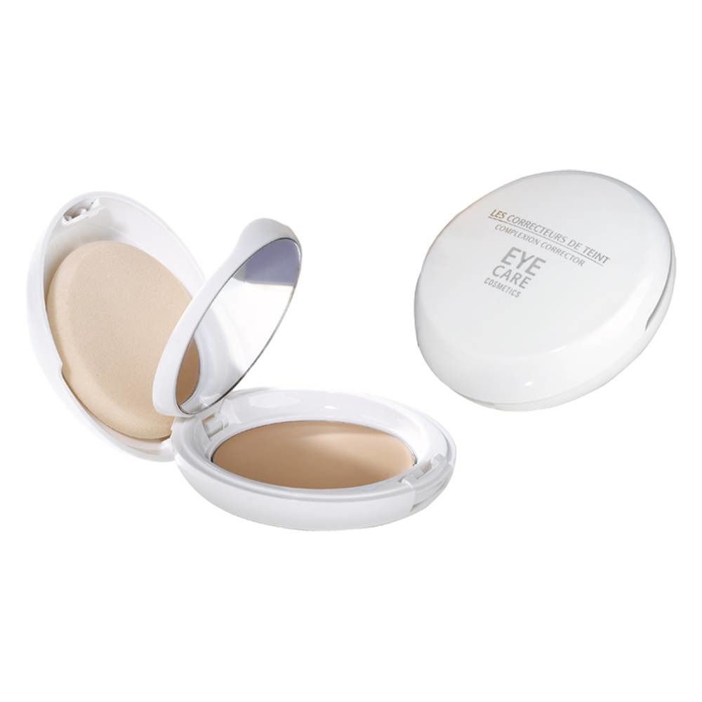 Weißer, ovaler Kompaktpuder mit Spiegel und Applikator. Auf dem Deckel steht "Eye Care".