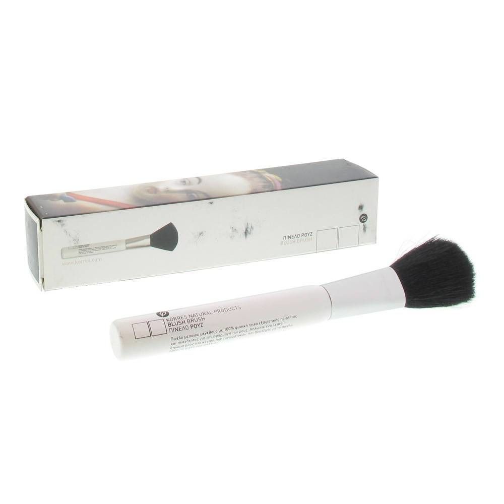 Pinsel mit schwarzem Pinselkopf und weißem Griff. Daneben die Verpackung mit Produktabbildung und Text.